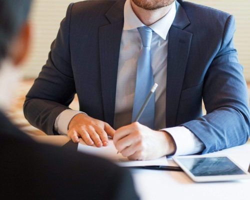 serious-manager-interviewing-applicant